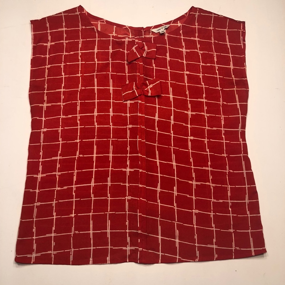 Sleeveless red blouse